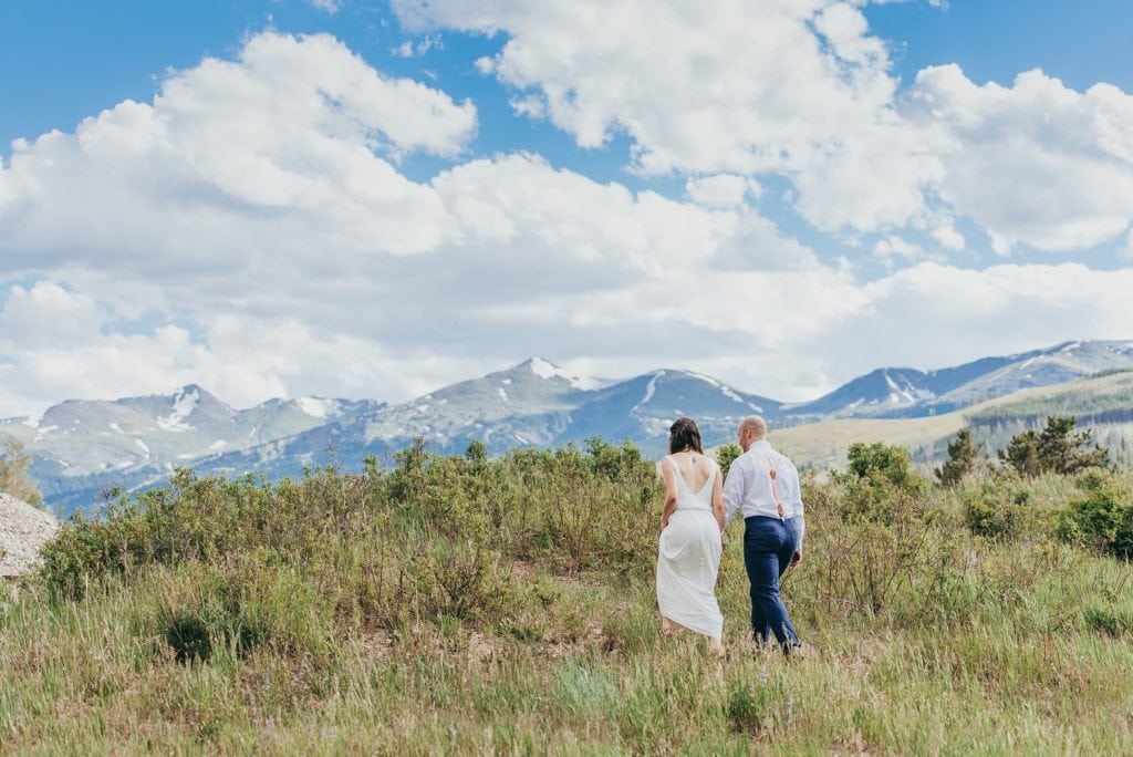 Bride and groom hike in Breckenridge, Colorado mountains