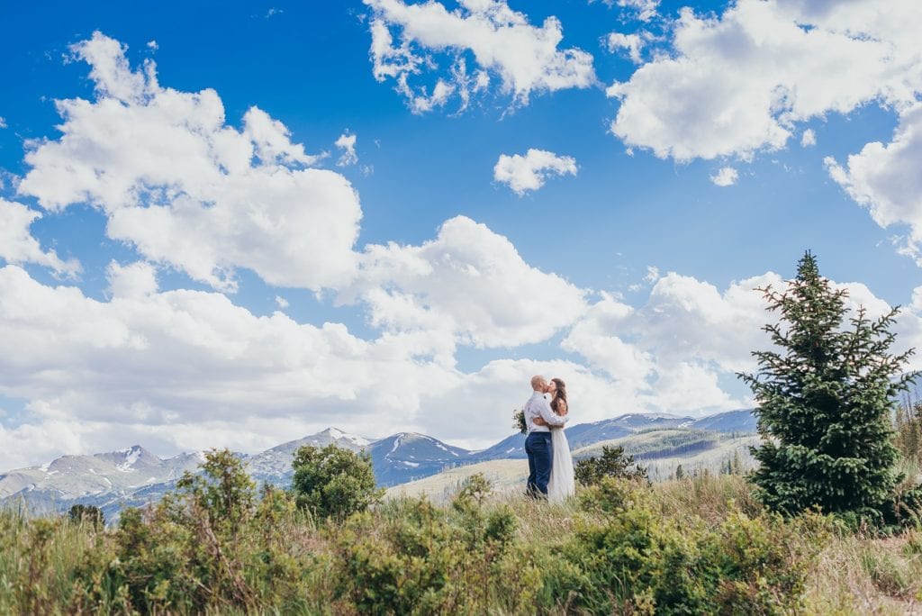 Wedding couple kisses amongst Breckenridge, Colorado mountains