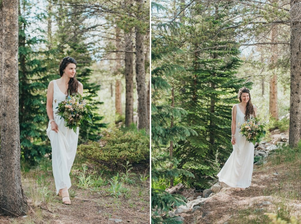 Adventure bride walks through Breckenridge, Colorado forest with her boho flowers bouquet