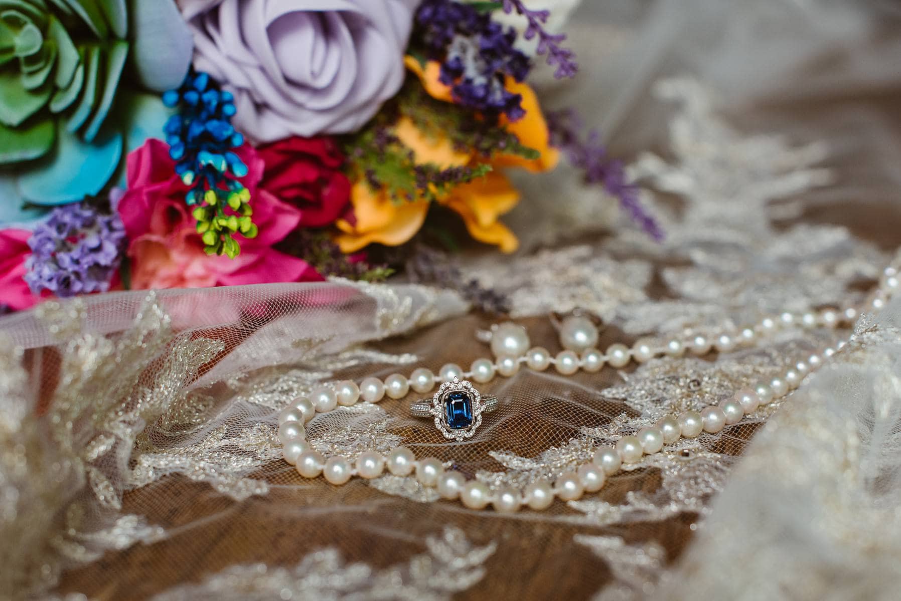 A vintage inspired sapphire white gold engagement ring with filigree